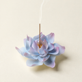Blue and lavender ceramic lotus holder with burning incense