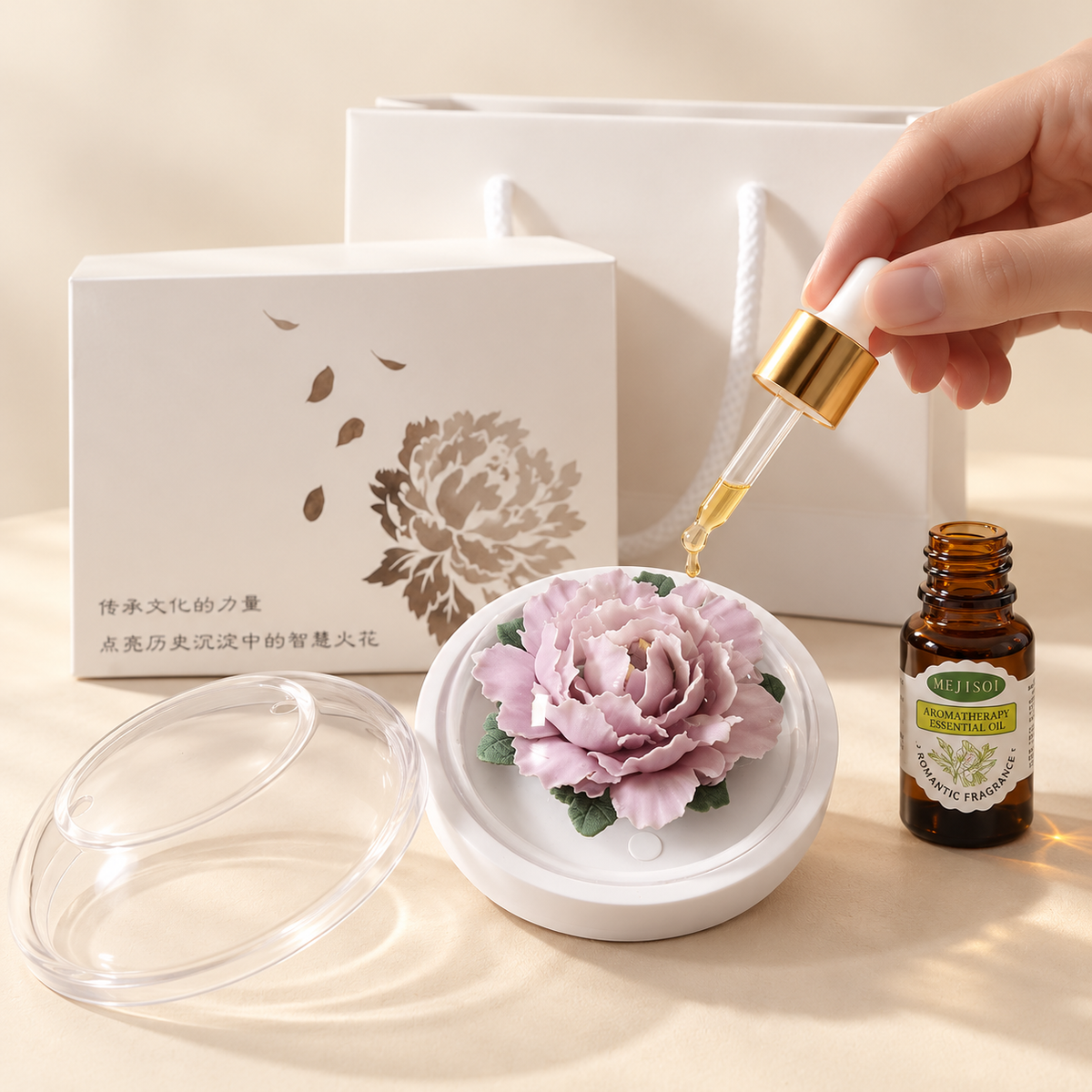 Lavender ceramic peony flower and oil gift set, compact version — oil being dropped onto the ceramic flower petals