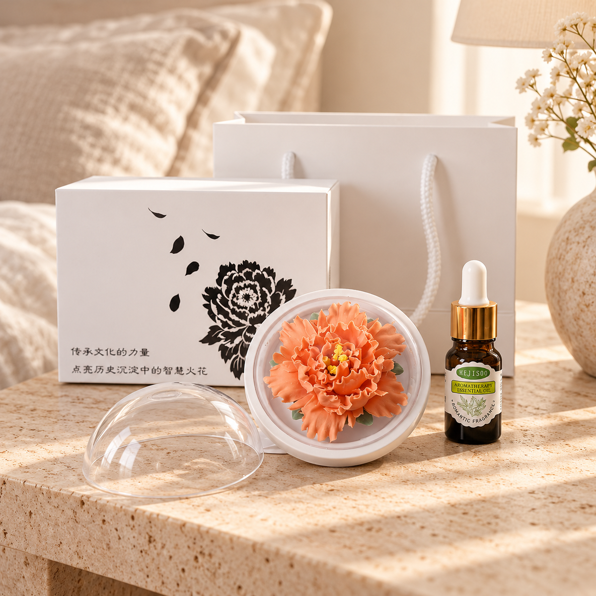 Orange ceramic peony flower and oil gift set, compact version — gift set styled on a bedside table in a beige room