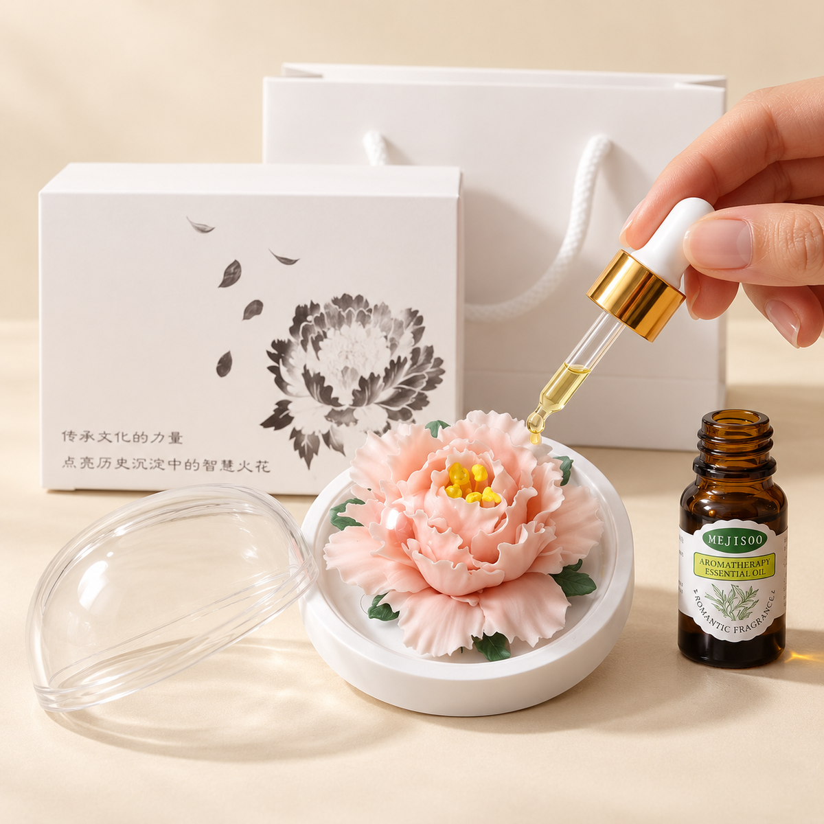 Peach ceramic peony flower and oil gift set, compact version — oil being dropped onto the ceramic flower petals