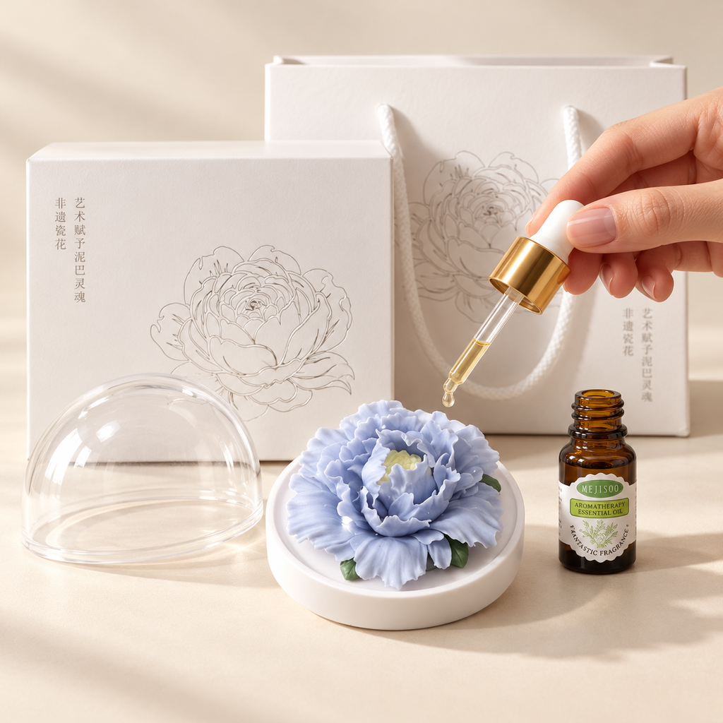 Periwinkle ceramic peony flower and oil gift set, large version — oil being dropped onto the ceramic flower petals