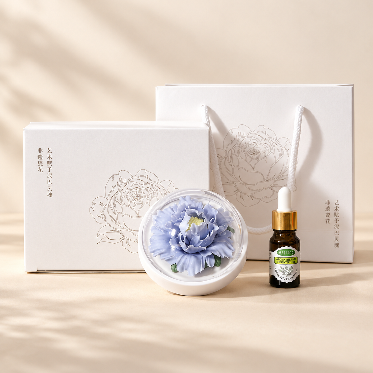 Periwinkle ceramic peony flower and oil gift set, large version — complete gift set on a beige background