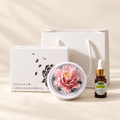 Pink ceramic peony flower and oil gift set, compact version — complete gift set on a beige background