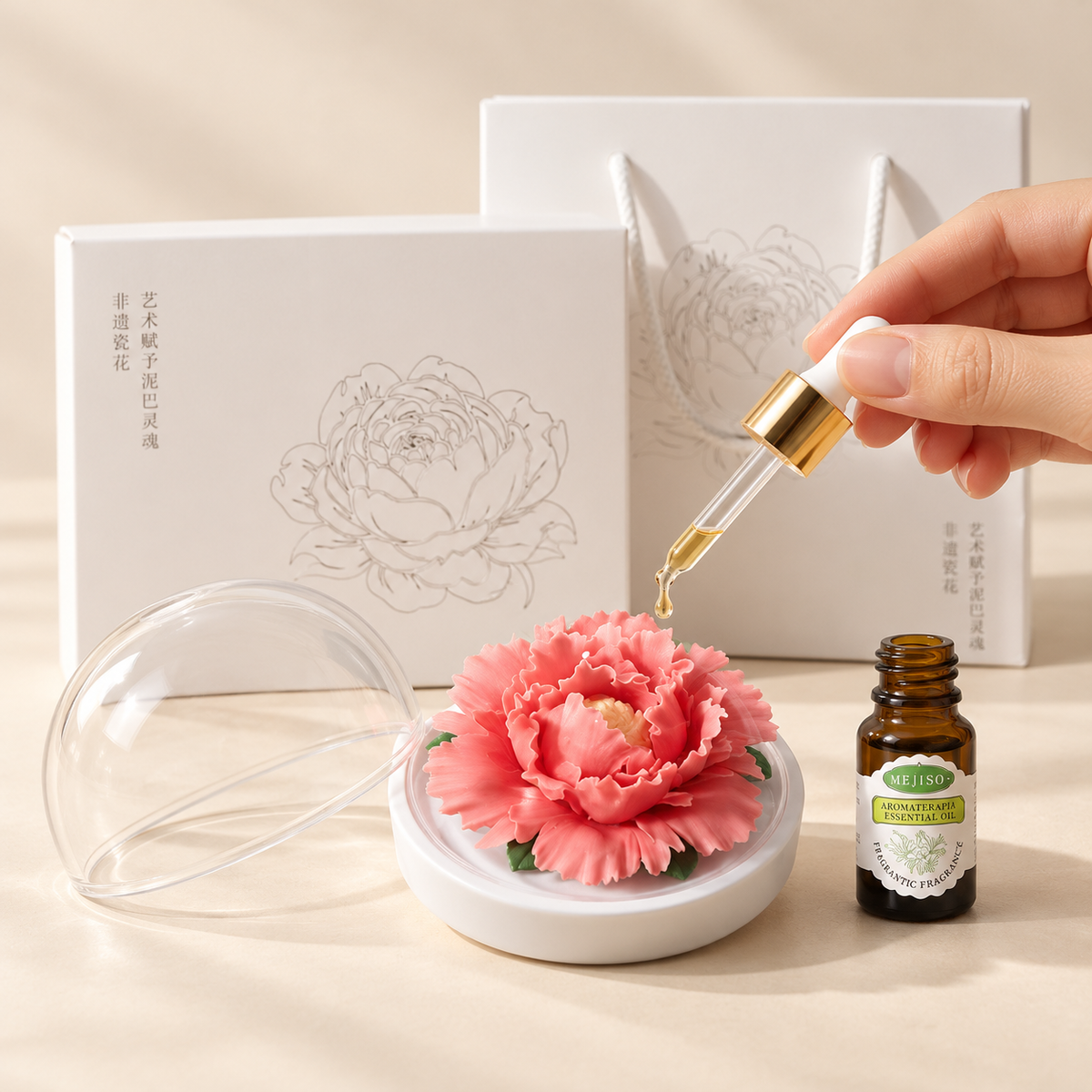 Rose Red ceramic peony flower and oil gift set, large version — oil being dropped onto the ceramic flower petals