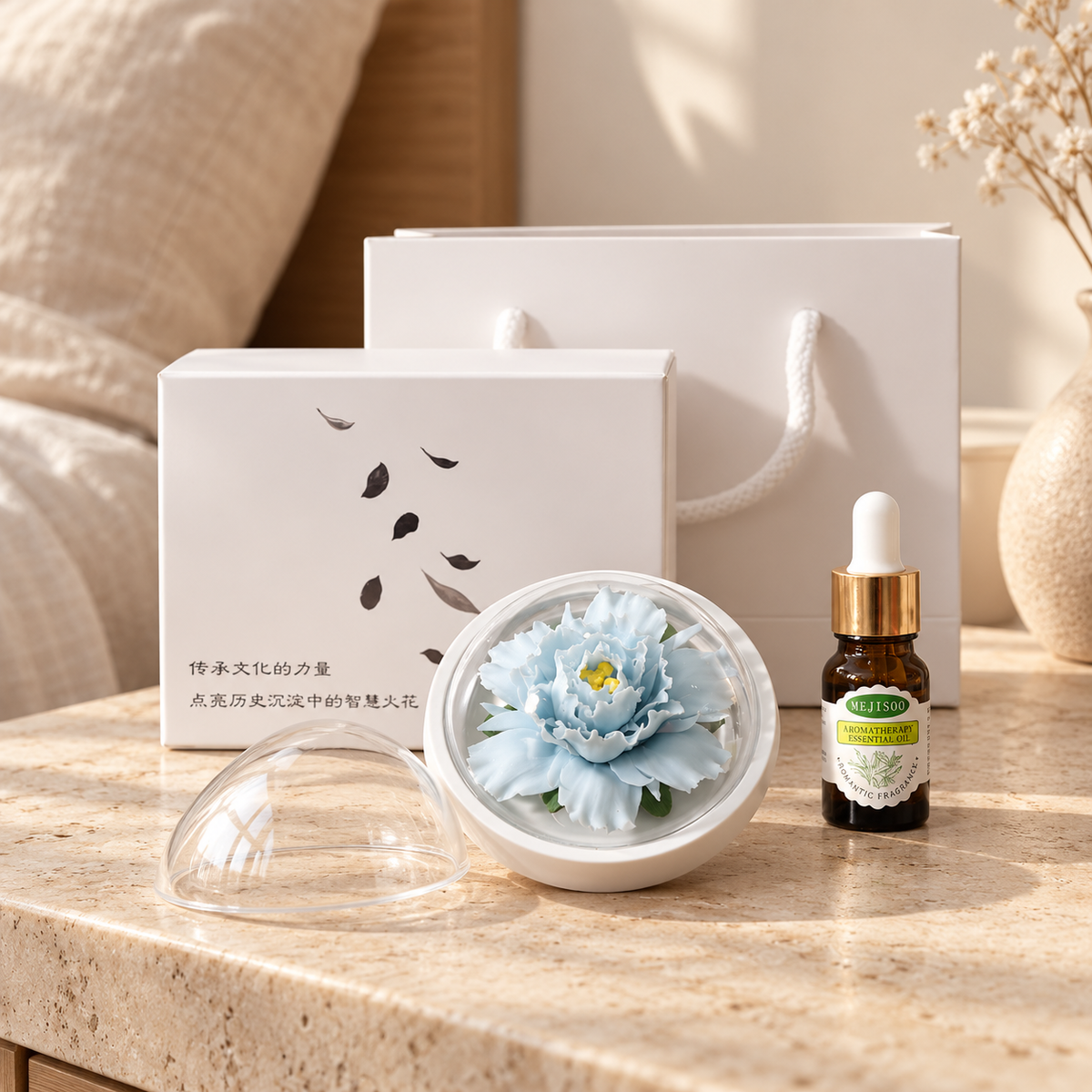 Sky Blue ceramic peony flower and oil gift set, compact version — gift set styled on a bedside table in a beige room