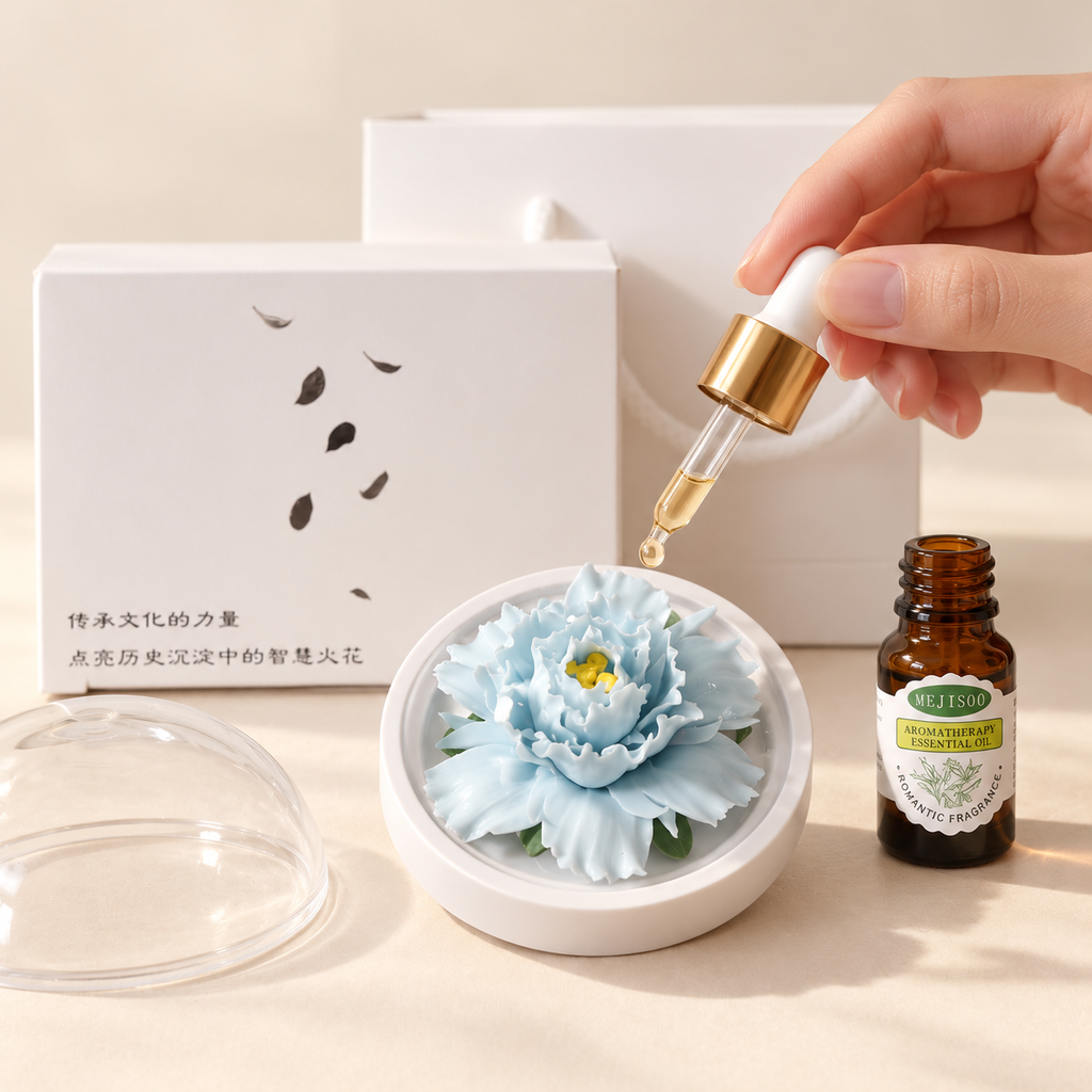 Sky Blue ceramic peony flower and oil gift set, compact version — oil being dropped onto the ceramic flower petals